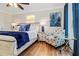 Cozy bedroom featuring a queen bed with white wood frame, blue accents, and nautical decor at 328 6Th Ave, Indian Rocks Beach, FL 33785