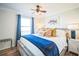 Bright bedroom featuring a comfortable bed with stylish decor, window, and hardwood floors at 328 6Th Ave, Indian Rocks Beach, FL 33785