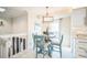Charming dining area with a round table, stylish chairs, and ample natural light at 328 6Th Ave, Indian Rocks Beach, FL 33785