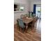 Charming dining room with a wooden table, upholstered chairs, and serene lake views at 328 6Th Ave, Indian Rocks Beach, FL 33785