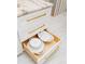 Elegant white kitchen drawers with gold hardware, showcasing ample storage space at 328 6Th Ave, Indian Rocks Beach, FL 33785