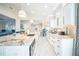 Modern kitchen boasting stainless steel appliances, granite countertops, and ample cabinet space at 328 6Th Ave, Indian Rocks Beach, FL 33785