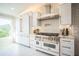 Modern kitchen featuring stainless steel appliances, granite countertops, and ample cabinet space at 328 6Th Ave, Indian Rocks Beach, FL 33785