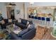 Bright, open living room with modern sofas, adjacent to a stylish kitchen with bar seating at 328 6Th Ave, Indian Rocks Beach, FL 33785