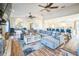 Spacious living room with a large sectional sofa, modern decor, and an open concept to the kitchen at 328 6Th Ave, Indian Rocks Beach, FL 33785