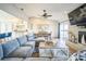 Cozy living room showcasing a fireplace, comfortable seating, and open-concept layout at 328 6Th Ave, Indian Rocks Beach, FL 33785