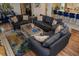 Spacious living room with modern furnishings, including multiple couches, a colorful rug, and wood flooring at 328 6Th Ave, Indian Rocks Beach, FL 33785