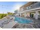 Outdoor pool, deck, string lights, lounge chairs, and covered patio make this space perfect for entertaining at 328 6Th Ave, Indian Rocks Beach, FL 33785