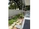 View of backyard with a white fence and some vegetation at 5015 N 29Th St, Tampa, FL 33610