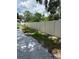 Fenced backyard with concrete border and some plants at 5015 N 29Th St, Tampa, FL 33610