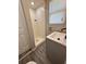 The bathroom features a walk-in shower, modern vanity, and tiled floor at 5015 N 29Th St, Tampa, FL 33610