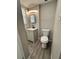 Cozy bathroom with modern vanity, fixtures, and wood-look flooring at 5015 N 29Th St, Tampa, FL 33610