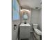 The bathroom features a modern vanity, toilet, and tile flooring at 5015 N 29Th St, Tampa, FL 33610