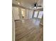 This bedroom has wood-look floors, a ceiling fan, and bathroom access at 5015 N 29Th St, Tampa, FL 33610