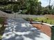 View of driveway, fence, and garden area at 5015 N 29Th St, Tampa, FL 33610