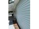 Showing the side of the home, featuring blue siding and a back porch at 5015 N 29Th St, Tampa, FL 33610