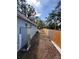 The home features a spacious side yard with a privacy fence and new AC unit at 5015 N 29Th St, Tampa, FL 33610