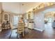 Dining room with natural lighting, a round table, and a serving bar with wine storage at 6935 Runner Oak Dr, Wesley Chapel, FL 33545
