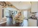 Dining room features a round table, views into the office and living room, and a serving counter at 6935 Runner Oak Dr, Wesley Chapel, FL 33545