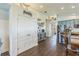 Spacious open-concept area showing a kitchen featuring a pantry, granite countertops, and modern cabinets at 6935 Runner Oak Dr, Wesley Chapel, FL 33545