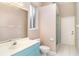The bathroom features light blue cabinets, and a walk-in shower with tile surround at 924 Texas St, Englewood, FL 34223