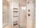 Bathroom featuring a stand-up shower with tiled storage shelves at 924 Texas St, Englewood, FL 34223