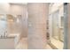 The bathroom features decorative tile, a walk-in shower and soaker tub at 924 Texas St, Englewood, FL 34223