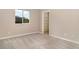 A neutral toned bedroom has carpeted floors and a window providing natural light at 924 Texas St, Englewood, FL 34223