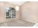 Bright bedroom with a decorative window and neutral carpet at 924 Texas St, Englewood, FL 34223