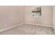 Bright bedroom with neutral tones and carpet flooring at 924 Texas St, Englewood, FL 34223