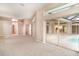 Open concept living space with tile floors, neutral walls and access to outdoor living space at 924 Texas St, Englewood, FL 34223