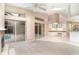 Spacious Living Room including a fireplace and sliding glass doors with a view of the pool at 924 Texas St, Englewood, FL 34223