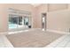 Open living room with access to the screened-in pool area and tile flooring at 924 Texas St, Englewood, FL 34223