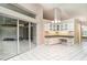 Open living area with sliding glass doors and built-in desk at 924 Texas St, Englewood, FL 34223