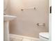Clean powder room with a pedestal sink and tile flooring at 924 Texas St, Englewood, FL 34223