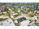 Aerial view of a waterfront community boasting lush landscaping and stunning water views at 3528 Casablanca Ave, St Petersburg, FL 33706