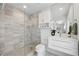 Elegant bathroom with a walk-in shower, stylish vanity, and modern fixtures at 3528 Casablanca Ave, St Petersburg, FL 33706
