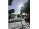 Gated beach access with lush palm trees offering a tranquil entrance to the pristine shoreline at 3528 Casablanca Ave, St Petersburg, FL 33706