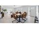 Inviting dining room with stylish furniture, seamlessly flowing into the bright and airy living space at 3528 Casablanca Ave, St Petersburg, FL 33706