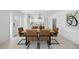 Modern dining area with sleek table and chairs, conveniently located between the kitchen and living room at 3528 Casablanca Ave, St Petersburg, FL 33706