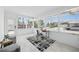 Bright room with large windows, neutral decor, tile flooring, and outside view at 3528 Casablanca Ave, St Petersburg, FL 33706