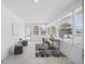 Sun-filled living room with lots of natural light, neutral decor, and tile flooring at 3528 Casablanca Ave, St Petersburg, FL 33706