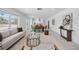 Open-concept living area showcasing stylish decor, seamlessly connecting the living, dining, and kitchen spaces at 3528 Casablanca Ave, St Petersburg, FL 33706