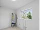 Bright utility room features durable tile flooring and a window providing natural light at 3528 Casablanca Ave, St Petersburg, FL 33706
