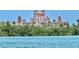 View of the Don CeSar Hotel from the water, nestled among lush greenery at 3528 Casablanca Ave, St Petersburg, FL 33706