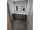 Bathroom features double sinks with illuminated mirrors and stylish gray cabinetry at 8114 Oak Trace Way # C, Tampa, FL 33634