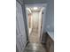 Hallway view leading to a bathroom with a shower-tub combo and adjacent closet at 8114 Oak Trace Way # C, Tampa, FL 33634