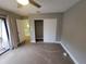 Spacious bedroom with balcony access and a closet offers ample storage space at 8114 Oak Trace Way # C, Tampa, FL 33634