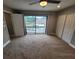 Bright bedroom features sliding glass doors to a balcony and ample closet space at 8114 Oak Trace Way # C, Tampa, FL 33634