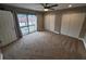 Bright bedroom features sliding glass doors to a balcony and ample closet space at 8114 Oak Trace Way # C, Tampa, FL 33634
